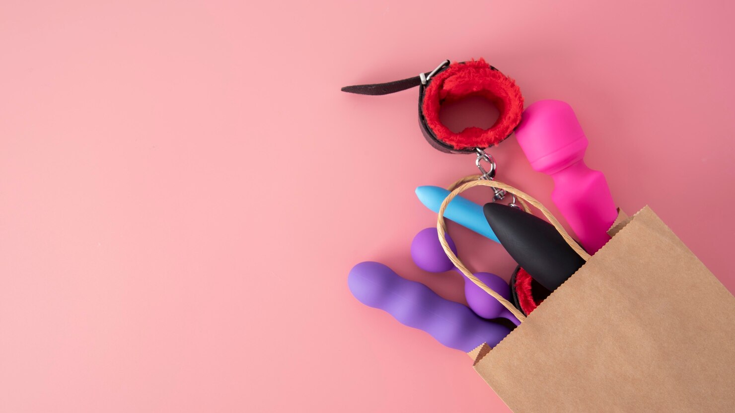 Close-up view of various sex toys arranged together, highlighting their designs and textures.